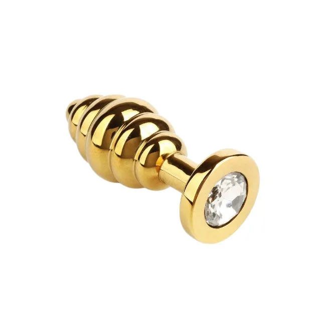 Plug anal MR. STEEL Twister Butt Plug Medium. din oțel inoxidabil. cu striații și bază cu cristal. lungime 7.8 cm (mediu). auriu